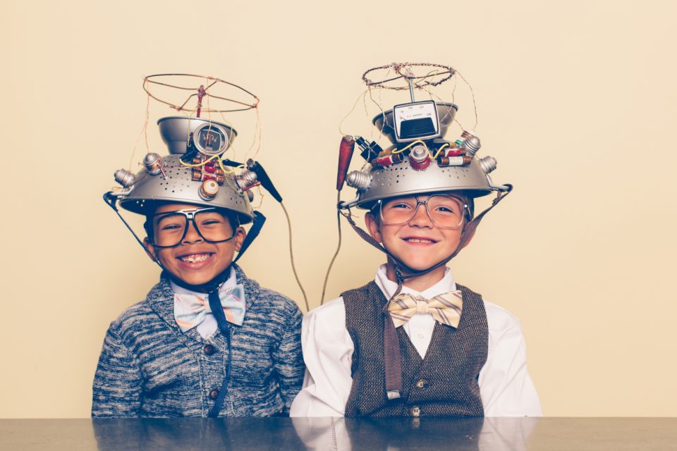Two Boys Dressed as Nerds Smiling with Mind Reading Helmets