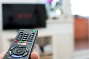 Netflix button on a TV remote with television.