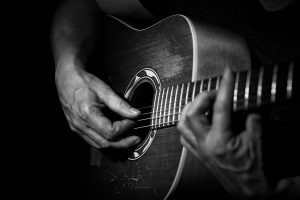 Black and white Close up of a guitarplayer at Dogwood Jamboree